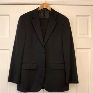 Black suit (with narrow strips) along with matching pants.